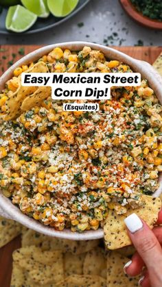 mexican street corn dip recipe in a bowl with tortilla chips