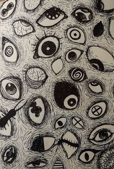 an image of many different eyes drawn on paper