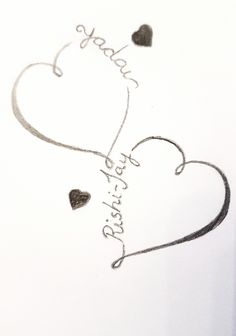 two hearts with the words happy birthday written on them in cursive writing,