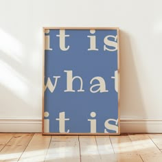 a blue and white poster with the words it is what it is written on it