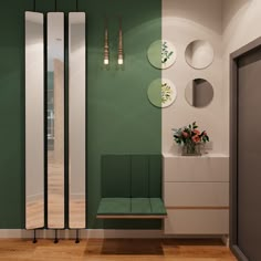 a room with green and white walls, wooden flooring and plates on the wall