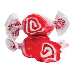 two lollipops with white and red swirl on them, sitting next to each other