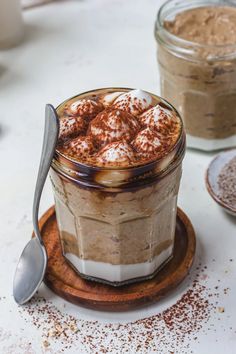 there is a dessert in a glass on the table