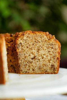 two slices of banana bread sitting on top of a white plate next to each other