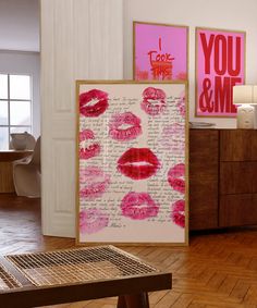 there are many pink and red lipstick prints on the wall next to each other in this room