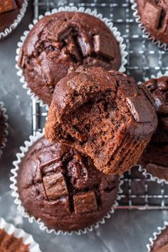 several chocolate muffins on a cooling rack