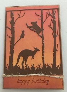 a happy birthday card with an image of a kangaroo in the woods and a bird sitting on top of it