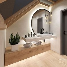 a bathroom with a sink, mirror and plants on the counter in front of it