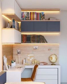 a room with a desk, bookshelf and chair in it that has many books on the shelves