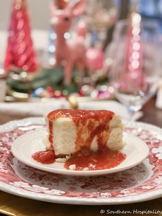 a piece of cake is sitting on a plate with sauce and marshmallows