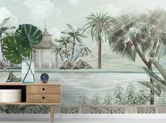 a tropical wall mural with palm trees and a gazebo in the distance, on a wooden dresser