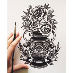 a drawing of a vase with flowers and leaves on it, next to a pencil