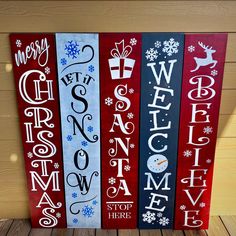 three wooden signs with christmas lettering on them