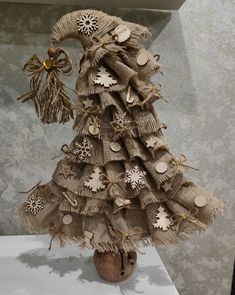 a christmas tree made out of burlocks and buttons