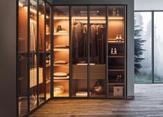 a walk in closet with sliding glass doors