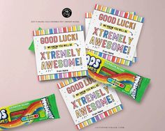 candy bar wrappers with the words good luck and extremely awesome written on them in rainbow colors