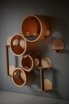 a bunch of wooden objects are hanging on the wall