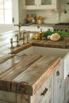 Butcher block countertops bring a warm, rustic charm to any farmhouse kitchen. They're not just aesthetically pleasing; they're incredibly functional, too. If #farmhousekitchen Diy Farmhouse Countertop, Farm Style Small Kitchen, Raw Wood Countertop, Farmhouse Kitchen White Cabinets Wood Countertops, Kitchen Design Farmhouse Modern, Raw Wood Countertops, Reclaimed Wood Kitchen Countertops, Kitchen Islands With Butcher Block Tops, Cozy Country Kitchen Ideas