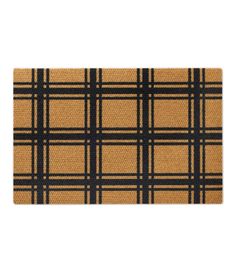 a yellow and black plaid door mat