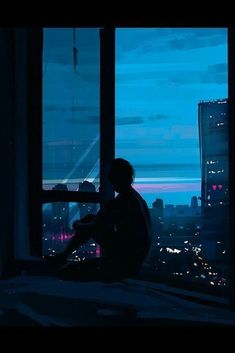 a person sitting on a window sill looking out at the city lights and skyscrapers