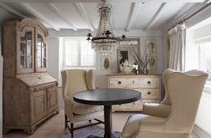 a dining room with chairs and a chandelier