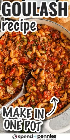 a pot filled with pasta and beans on top of a wooden table