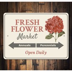 a sign that says fresh flower market and an open daily