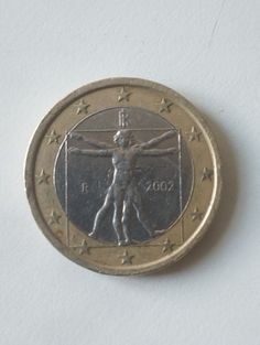 a close up of a coin with a person on the back and stars around it