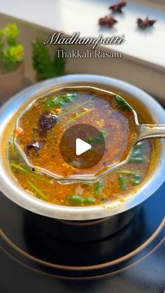 a bowl filled with soup sitting on top of a stove