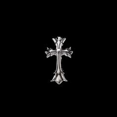 a silver cross on a black background