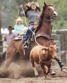 a woman riding on the back of a brown horse