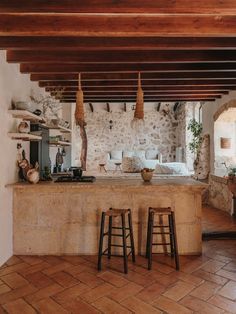 two stools sit in front of an island counter