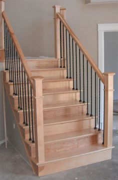 a set of stairs with handrails in a house