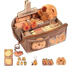 a brown teddy bear sitting in an open suitcase with other items around it on a white background