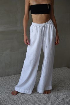 Upgrade your summer wardrobe with our modern, full-length linen pants. Made from 100% high-quality European linen, these breathable, wide-leg pants are perfect for staying cool and comfortable in warm weather. Designed by a talented designer and sewn in a small studio in Lithuania, these pants feature convenient pockets and a comfortable elastic waistband. They are ideal for casual outings, chic summer events, or strolls on the beach. Pair them with your favorite sandals or sneakers for an effor Linen Summer Pants, Thailand Outfits, Linen Pants For Women, Thailand Outfit, Summer Linen Pants, Linen Pants Outfit, Pants Linen, White Linen Pants, Outfit Inspo Summer