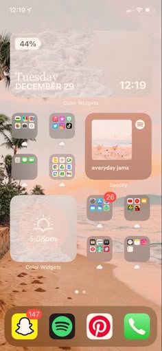 an iphone screen with icons on it and the beach in the backgroung