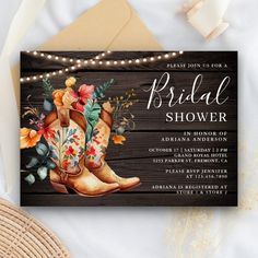 the rustic cowboy boots bridal shower is displayed on top of an envelope with string lights