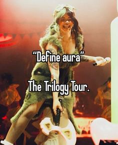 a woman on top of a toilet with the caption define aura the trilogy tour