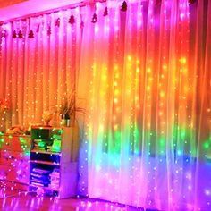 the room is decorated with colorful lights and curtains