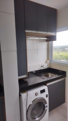 a washer and dryer in a small kitchen