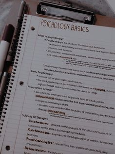 a notepad with the words psychology basics written on it