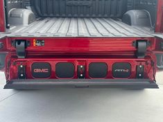 the back end of a red pickup truck