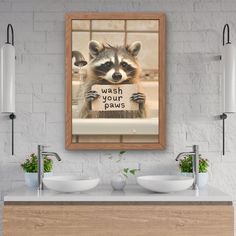 a raccoon holding a sign that says wash your hands in front of two sinks