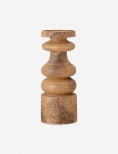 a small wooden candle holder on a white background