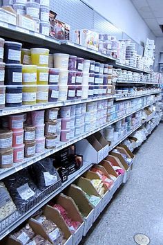 shelves in a grocery store filled with lots of food