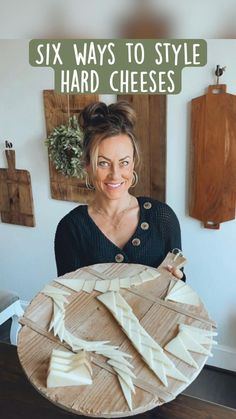 a woman holding a plate with cheese on it and the words six ways to style hard cheeses