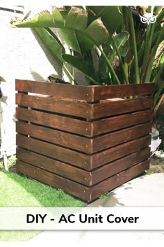 a wooden planter sitting on top of a lush green field