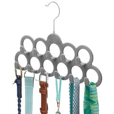 several umbrellas are hanging on a rack with hooks and ties attached to the hangers