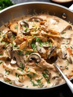 a skillet filled with mushrooms and sauce