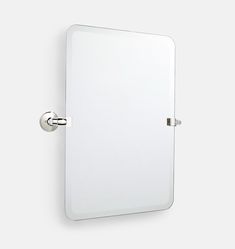 a mirror mounted to the side of a wall with a metal hook on it's end